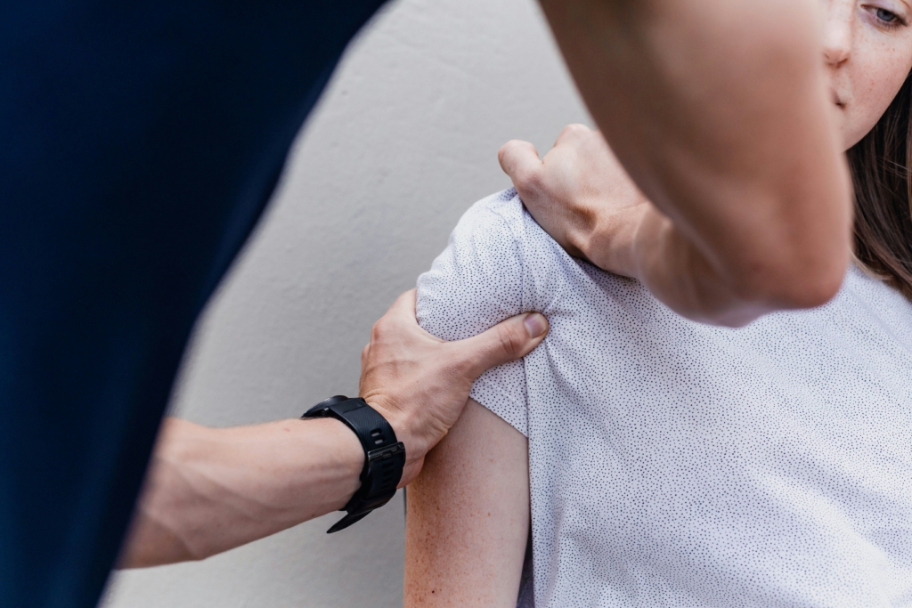 a woman holding onto a mans arm